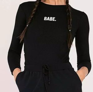 boutique Tops - New with tags black 'BABE' long sleeved bodysuit boutique Tops - New with tags black 'BABE' long sleeved bodysuit